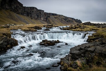 waterfall in the mountains and cloudy weather.