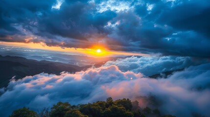 Fototapeta premium Breathtaking sunrise over clouds, showcasing vibrant colors in the sky and lush trees in the foreground.