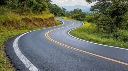 Serene Winding Road Through Lush Greenery in Scenic Landscape with Rolling Hills and Clear Skies in Background