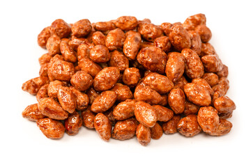 Tasty sweet roasted peanuts isolated on a white background.