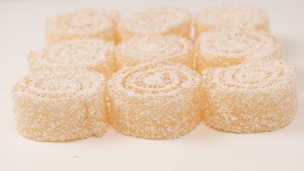 Coconut candy roll isolated on a white background.
