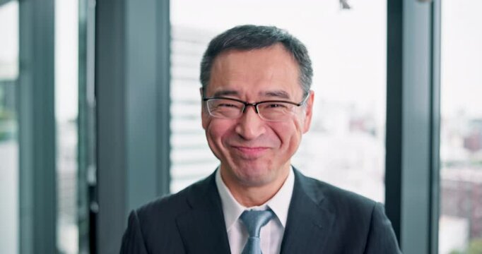 Happy, face and mature man in office, ceo and joy for customer growth, profit and revenue in bank. Finance, boss and smile for investment in firm, economy and corporate person with glasses in Japan
