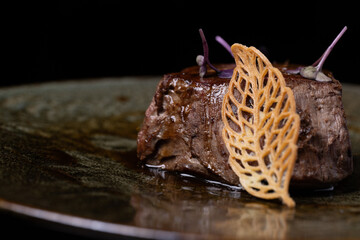 meat fillet with leaf of bread