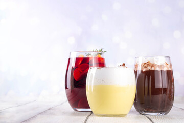 Hot drink cafes menu background, with mulled wine, eggnog and hot chocolate traditional Christmas winter cocktails and beverages, with Christmas New Year festive holiday decorations, copy space