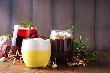 Hot drink cafes menu background, with mulled wine, eggnog and hot chocolate traditional Christmas winter cocktails and beverages, with Christmas New Year festive holiday decorations, copy space