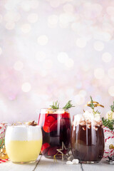 Hot drink cafes menu background, with mulled wine, eggnog and hot chocolate traditional Christmas winter cocktails and beverages, with Christmas New Year festive holiday decorations, copy space