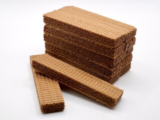 A close-up image of a crispy, layered wafer chocolate placed on a white background