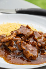Meat dish Caramel pork served with couscous