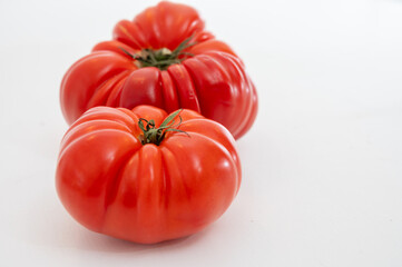 Sweet tasty ripe red french tomatoes from Brittany, France, salad seasonal vegetables