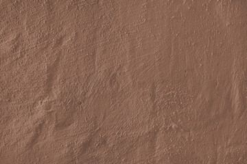 Stucco plaster surface, brushstroke background, close up, macro texture of brown painted cement, concrete wall texture. Wallpaper, backdrop, architecture design element