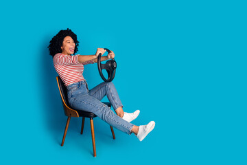 Photo of adorable cheerful girl wear stylish clothes drive car look road empty space isolated on...