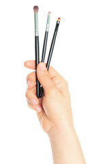 Woman hand holds Cosmetics Brushes, isolated on transparent background, cosmetics and visage concept