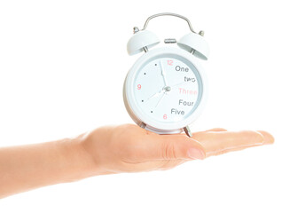 Woman hand holds white Alarm Clock, isolated on transparent background, time and home things concept