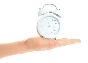 Woman hand holds white Alarm Clock, isolated on transparent background, time and home things concept