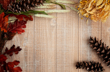 Fall flatlay with leaves and wheat on wooden background. Edit with text. 