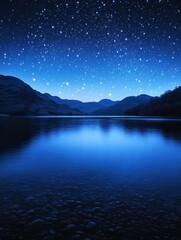 Starry night sky over a lake with rocks and mountains
