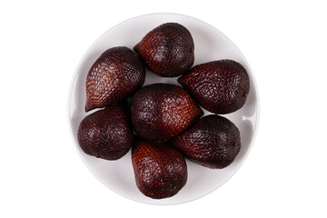 A group of snake fruits on a white plate isolated transparent