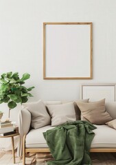 A cozy living room with a sofa, pillows, a throw blanket, and a framed picture