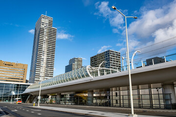 Parking central station The Hague Netherlands sunny day blue sky high houses back