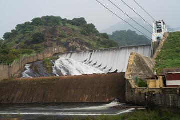 Man-made water reservoir overflows after a heavy rainfall. 
Location : Varathamanathi dam , Palani