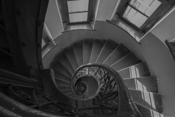 Spiral staircase going down in black and white