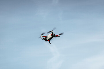 Remotely controlled drone with camera system in full operation