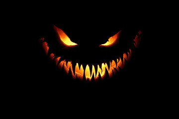 Fototapeta premium Glowing jack-o'-lantern with scary fangs
