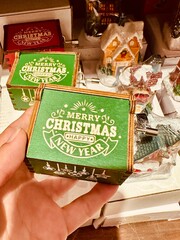 Green toy music box with inscription 