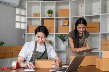 Young Couple Managing Online Business and Checking Product Inventory in Modern Home Office Setting