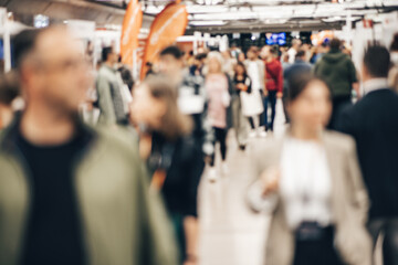 Abstract blurred people at exhibition hall of expo event trade show. Business convention show or...