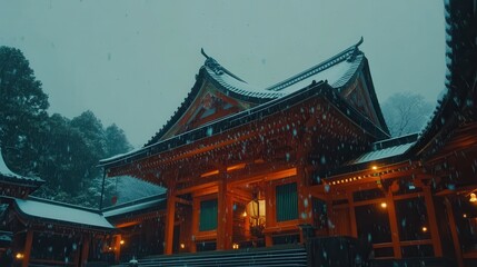 Obraz premium Gentle snowfall blanketing a traditional japanese temple at dusk serene winter landscape captured in tranquil evening light