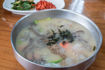 Korean Buckwheat Noodle Soup with Potato Dumplings (Ongshimi) and Fresh Green Kimchi