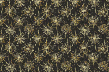 Golden spiderwebs hanging with dark black background