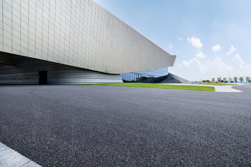 Empty asphalt road and office buildings in modern city