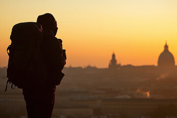 A backpacker silhouette against classical cityscape.