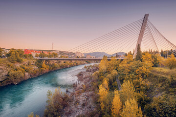 Iconic bridge in Podgorica, offering a panoramic view of the Moraca River and the city skyline, a stunning blend of modern architecture and natural beauty.
