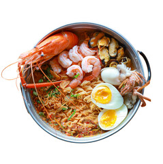 A vibrant seafood dish featuring shrimp, lobster, mussels, and boiled eggs, garnished with herbs and spices.