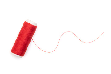 Red spool of thread isolated on white, top view