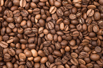Roasted coffee beans background. Coffee beans texture, top view