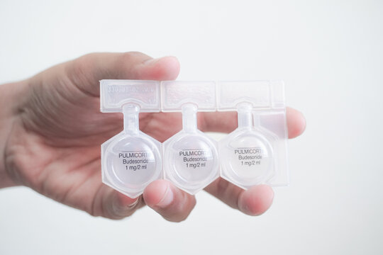 Balikpapan, November 11, 2024. Holding a bottle of Budesonide Budecort Respules Nebulizing Suspension. Budesonide sterile single dose units, used for bronchial asthma