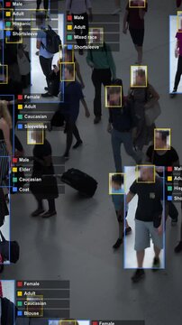 Crowded building with commuters walking. Artificial intelligence and facial recognition are used for surveillance purposes. Fake Individual data showing sex, race and clothing. Deep learning. 
