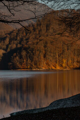 Late autumn sunset light at the lake in Firiza, Romania