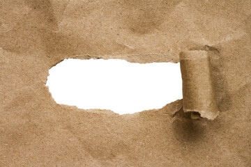 a torn sheet of cardboard with a tab hole revealing a transparent background