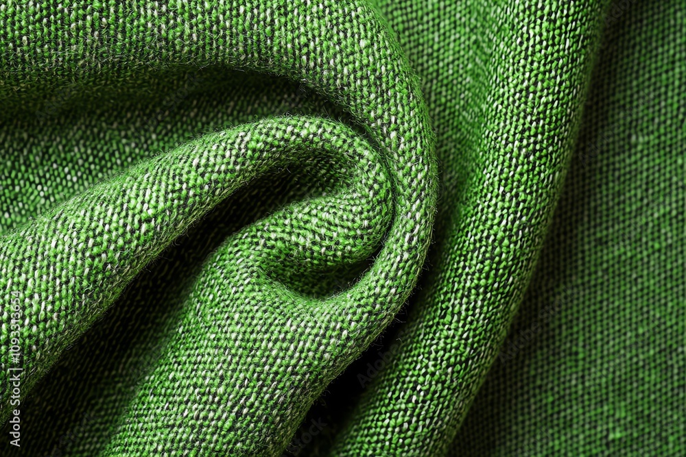 Poster a close-up of textured green fabric, showcasing its softness and depth. perfect for design and texti