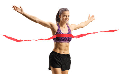 Young female finishing a running race with arms wide open