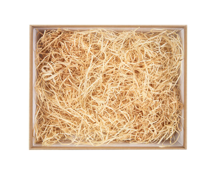 Top view of open cardboard box with shredded wood excelsior or wood wool for filling inside. Using natural sustainable material for wrapping or products background. Isolated on white, studio shot. - Powered by Adobe
