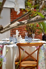 sophisticated and colorful table setting for lunch in the garden