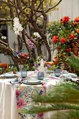 sophisticated and colorful table setting for lunch in the garden