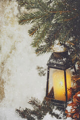 Forest animals gathered aroundglowing lantern in the snow  creatingmagical winter moment