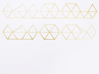 Geometric patterns of interlocking triangles in gold and white on a clean white surface, geometric pattern, luxury